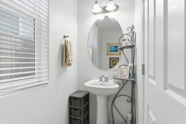 a bathroom with a sink and mirror