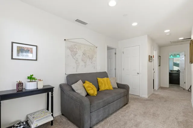 a living room with furniture and a couch