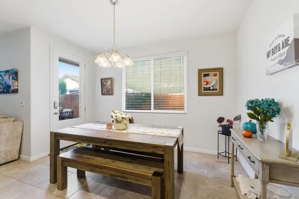 a kitchen with stainless steel appliances granite countertop a sink a stove and a wooden floors