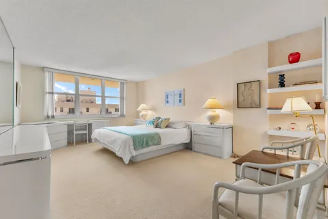 a bedroom with furniture and a window