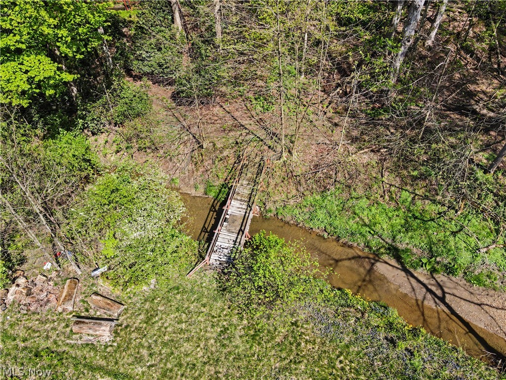 12376 Heath Road Chesterland, OH 44026 - Photo 3 of 50 Bridge over the stream that leads to the pond