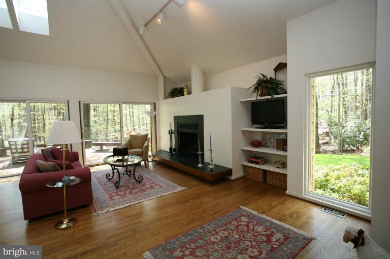 10927 Lawyers Road Reston, VA 20191 - Photo 1 of 30 a living room with furniture window and wooden floor