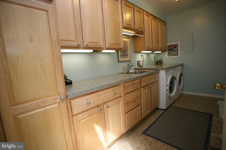 10927 Lawyers Road Reston, VA 20191 - Photo 2 of 30 a kitchen with stainless steel appliances a sink and cabinets