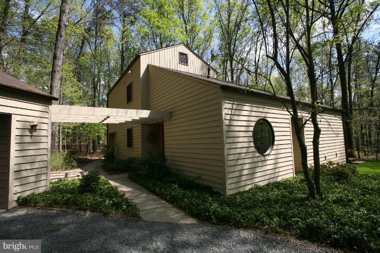 10927 Lawyers Road Reston, VA 20191 - Photo 14 of 30 a view of a small house with a yard and large tree