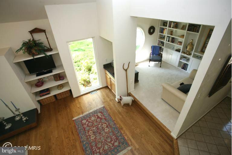 10927 Lawyers Road Reston, VA 20191 - Photo 16 of 30 a living room with furniture and a flat screen tv