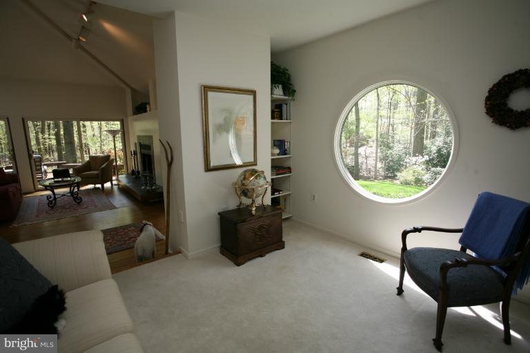 10927 Lawyers Road Reston, VA 20191 - Photo 18 of 30 a living room with furniture and a mirror