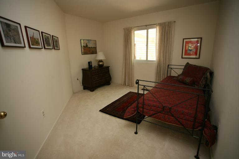 10927 Lawyers Road Reston, VA 20191 - Photo 19 of 30 a room with furniture and a window