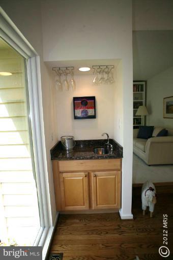 10927 Lawyers Road Reston, VA 20191 - Photo 27 of 30 a view of a kitchen with a sink and a stove top oven