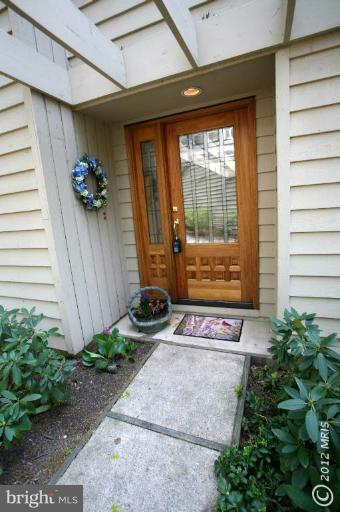 10927 Lawyers Road Reston, VA 20191 - Photo 7 of 30 a view of front door of house with potted plant