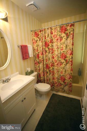 10927 Lawyers Road Reston, VA 20191 - Photo 10 of 30 a bathroom with a sink toilet and shower