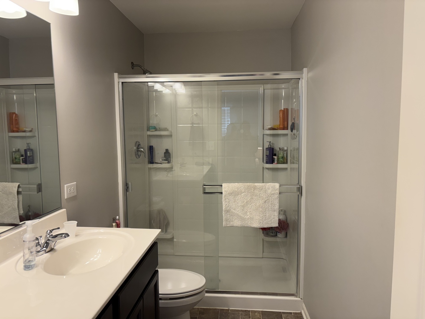 582 Spring Leaf Drive Joliet, IL 60431 - Photo 14 of 25 a bathroom with a sink and a mirror