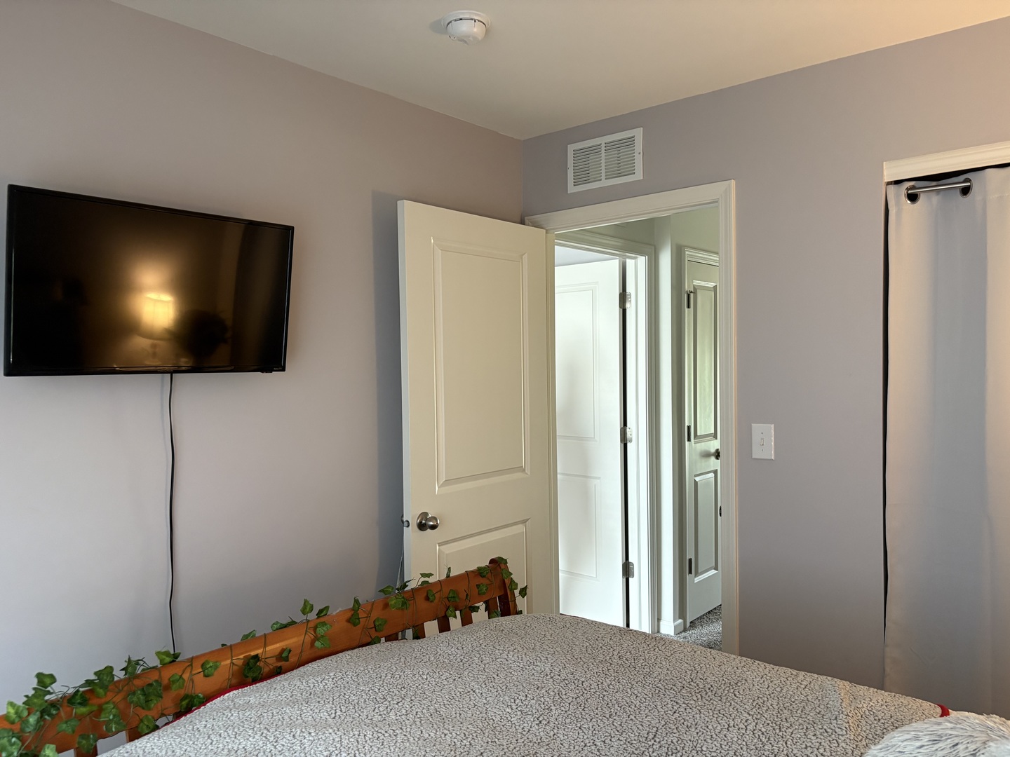 582 Spring Leaf Drive Joliet, IL 60431 - Photo 16 of 25 a bedroom with window and flat screen tv