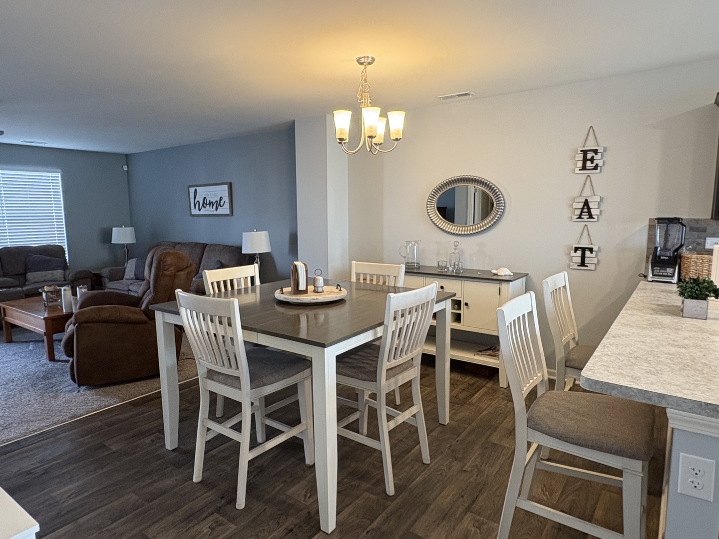 582 Spring Leaf Drive Joliet, IL 60431 - Photo 8 of 25 a view of a dining room with furniture and wooden floor