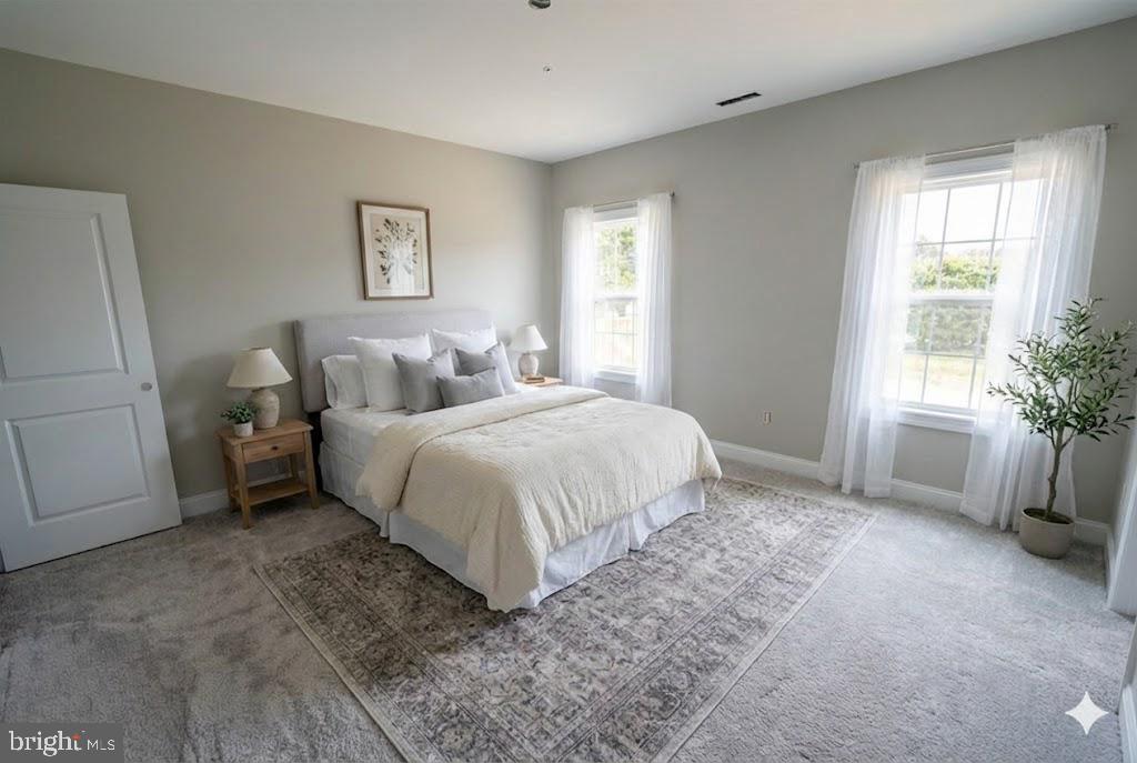 1 Jersey Road Salisbury, MD 21801 - Photo 16 of 19 a bedroom with a bed and a chair