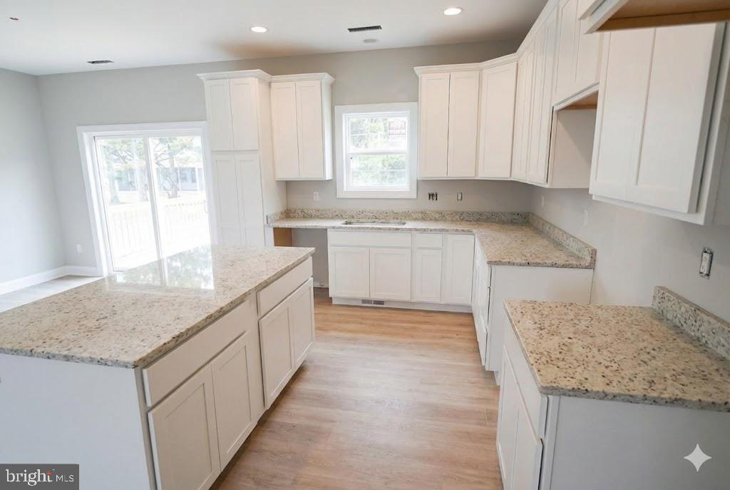 1 Jersey Road Salisbury, MD 21801 - Photo 7 of 19 a kitchen with granite countertop sink and cabinets