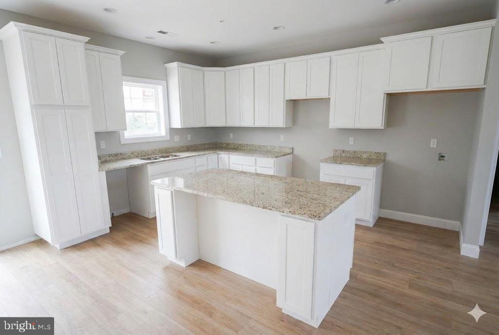 1 Jersey Road Salisbury, MD 21801 - Photo 8 of 19 a kitchen with a sink cabinets stainless steel appliances and a window