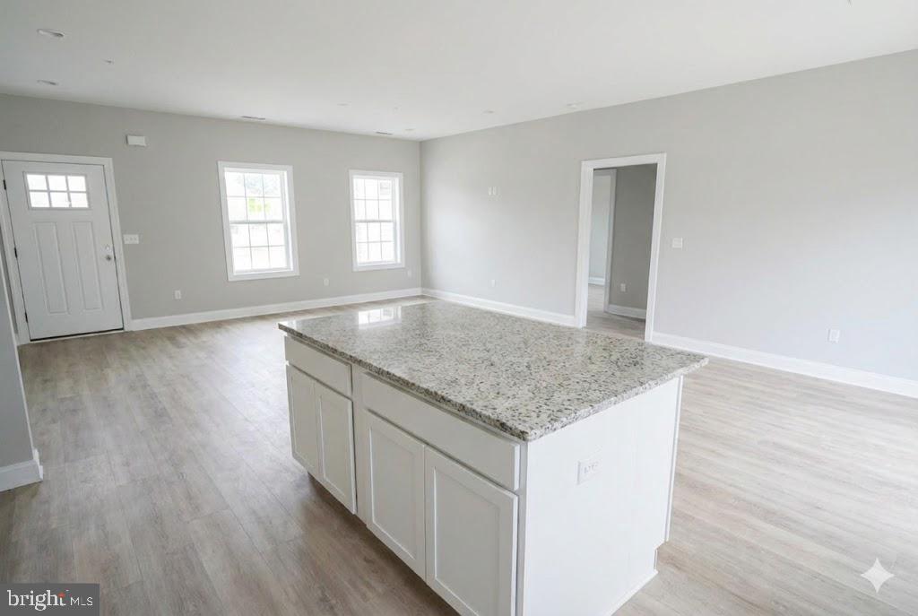 1 Jersey Road Salisbury, MD 21801 - Photo 9 of 19 an empty room with wooden floor and window