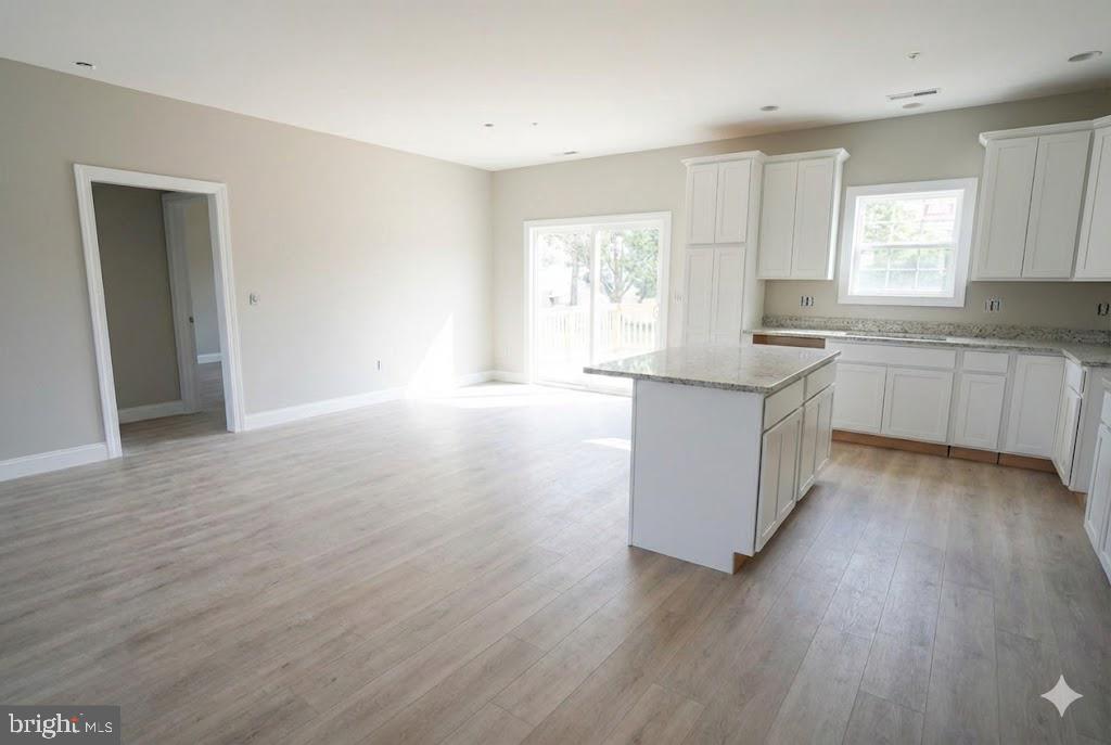 1 Jersey Road Salisbury, MD 21801 - Photo 10 of 19 a kitchen with a sink cabinets wooden floor and a window