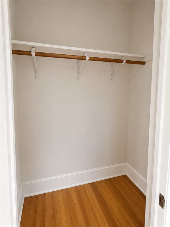 128 Shawmut Street, Unit 2 Chelsea, MA 02150 - Photo 3 of 12 a view of a room with racks on the wall