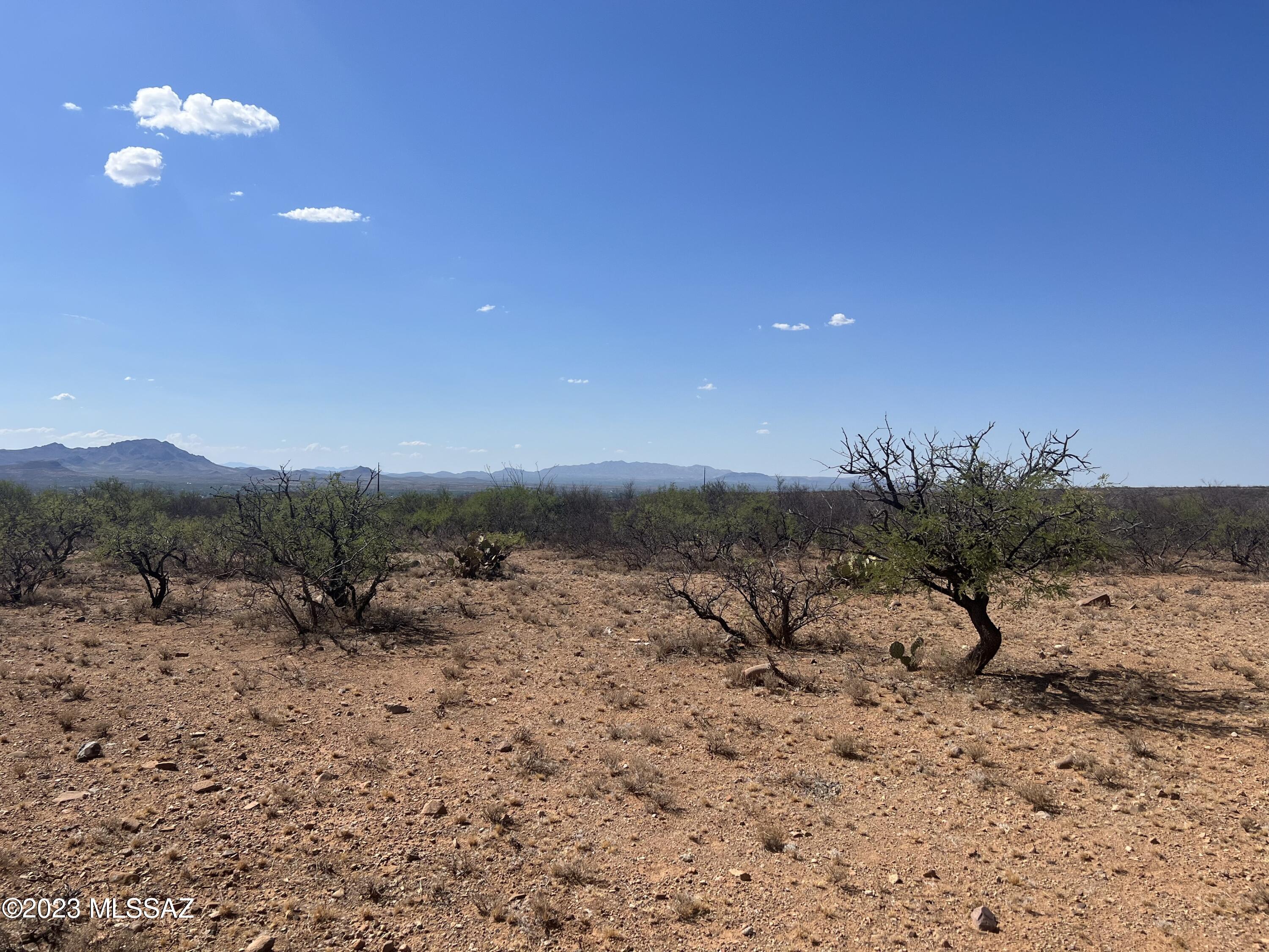 Tbd Tbd Camino Murphy, Unit 26 Rio Rico, AZ 85648 - Photo 5 of 14 a view of a beach with a mountain in the background