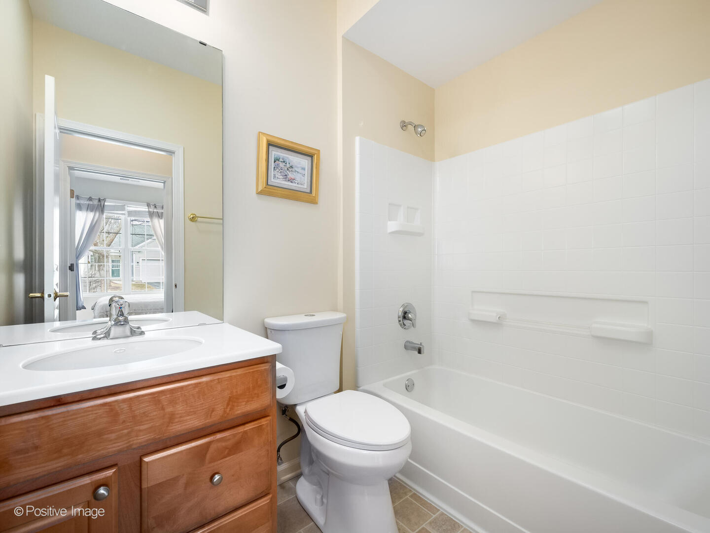 13497 Morgan Way Huntley, IL 60142 - Photo 15 of 19 a bathroom with a sink a toilet and a bathtub