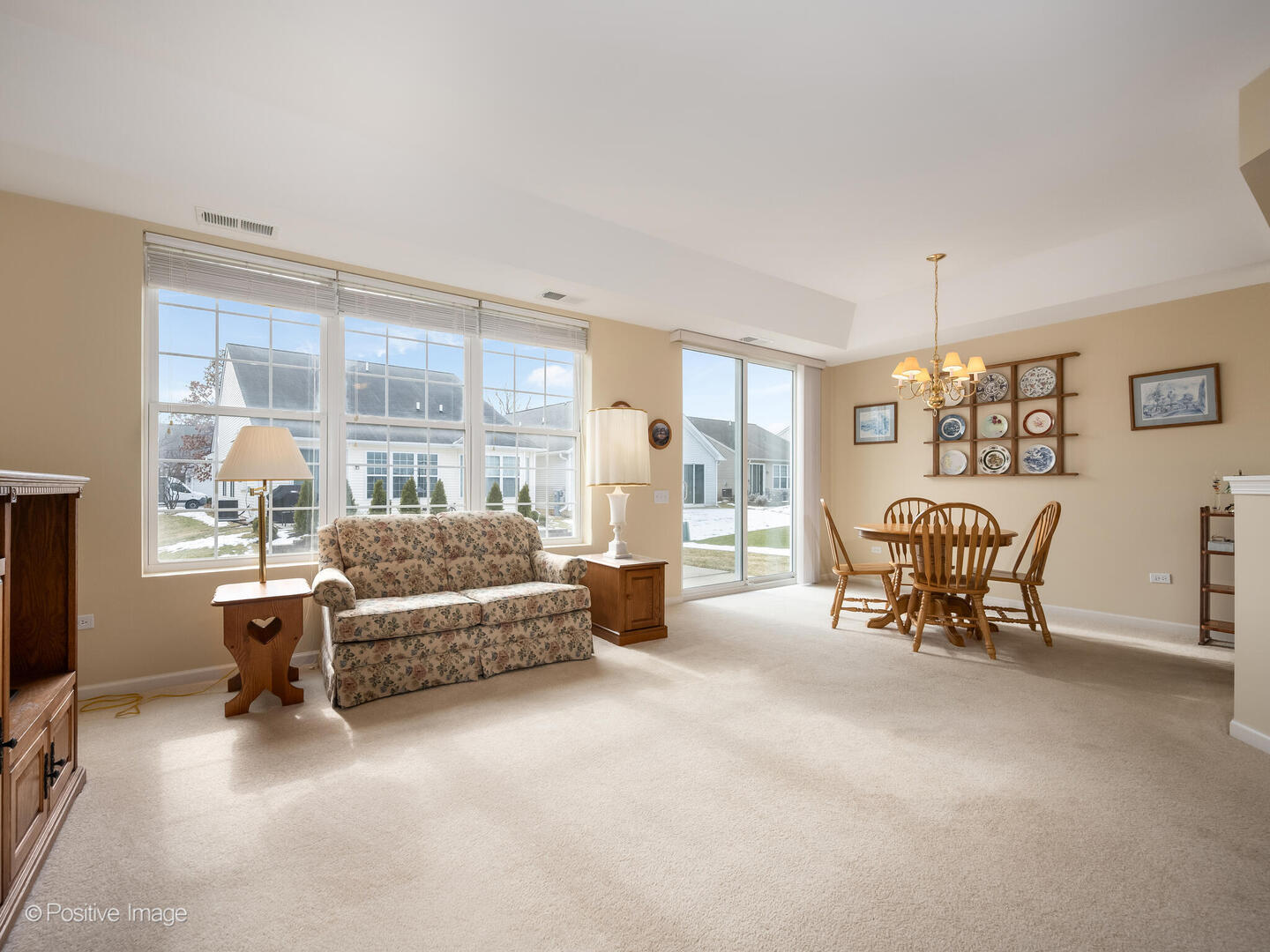 13497 Morgan Way Huntley, IL 60142 - Photo 2 of 19 a living room with furniture and a flat screen tv