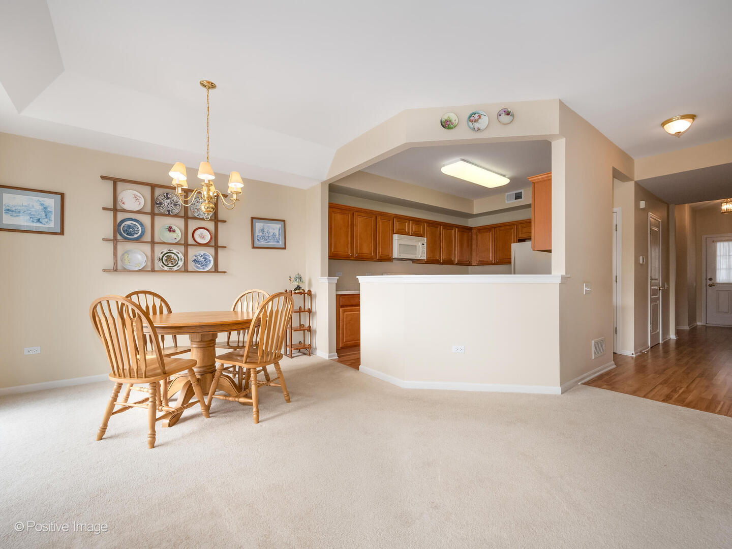 13497 Morgan Way Huntley, IL 60142 - Photo 4 of 19 a view of a dining room with furniture and chandelier