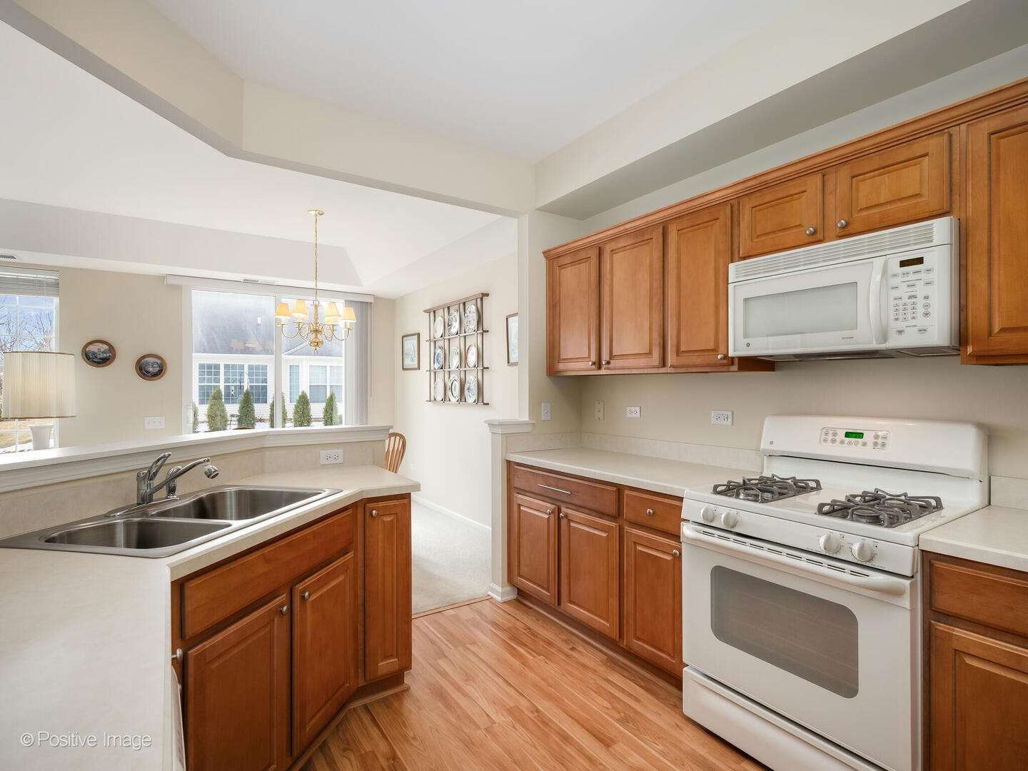 13497 Morgan Way Huntley, IL 60142 - Photo 5 of 19 a kitchen with stainless steel appliances granite countertop a sink and a stove