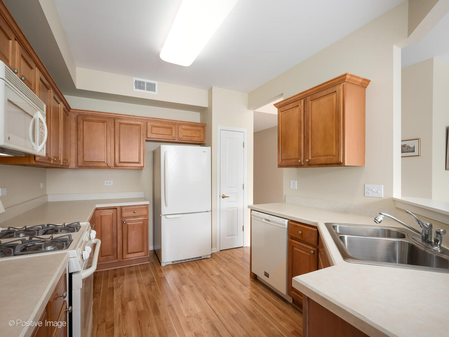 13497 Morgan Way Huntley, IL 60142 - Photo 6 of 19 a kitchen with stainless steel appliances granite countertop a refrigerator sink and stove