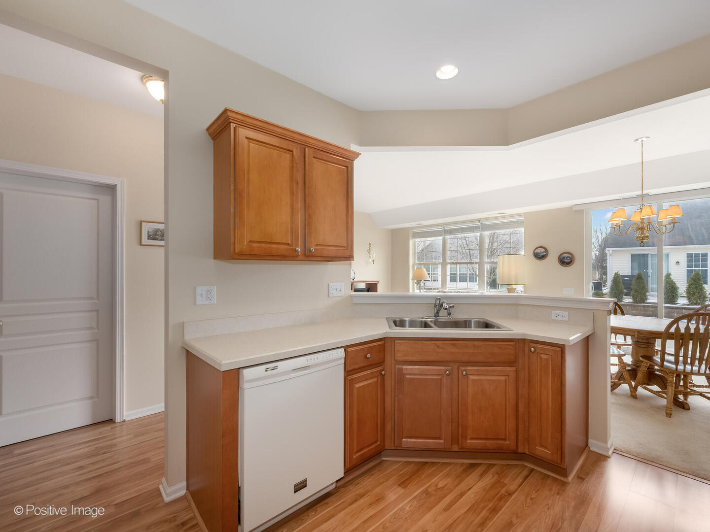 13497 Morgan Way Huntley, IL 60142 - Photo 7 of 19 a kitchen with a sink cabinets and wooden floor