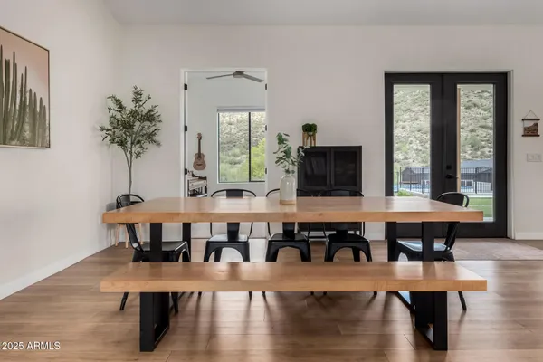 a view of a dining room with furniture window and wooden floor