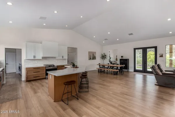 a kitchen with a table and chairs in it