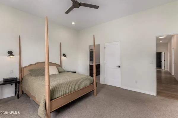 a bathroom with a double vanity sink toilet and a mirror