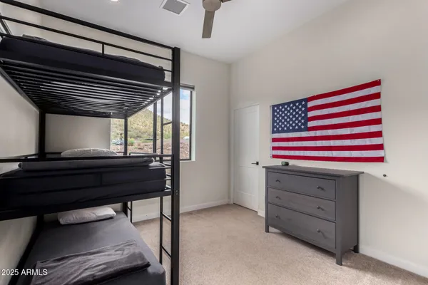 a bedroom with a bed and a closet