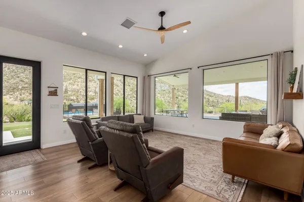 a living room with furniture and a large window