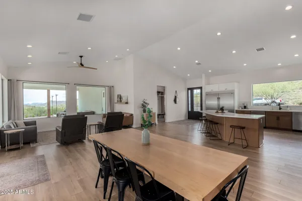 a view of a dining room with furniture and wooden floor