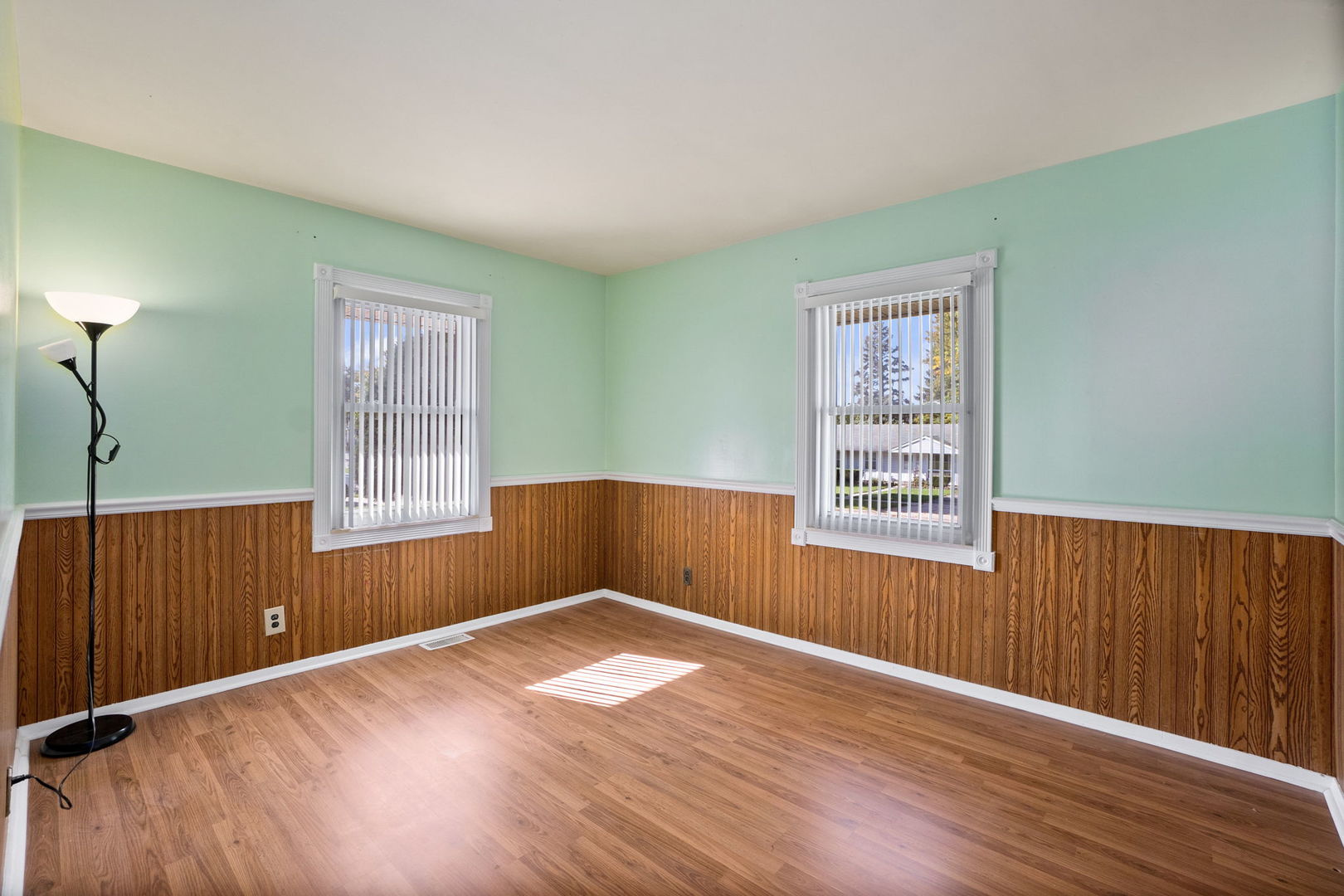 1275 Post Road Aurora, IL 60506 - Photo 14 of 30 an empty room with wooden floor and windows