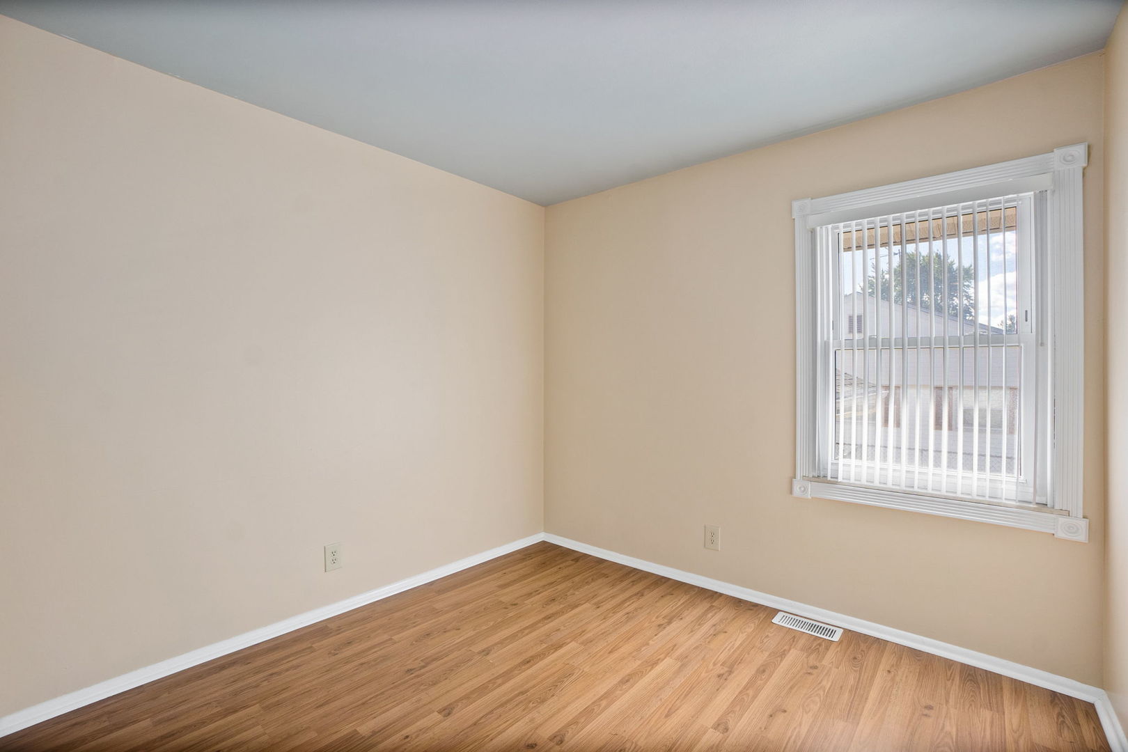 1275 Post Road Aurora, IL 60506 - Photo 15 of 30 wooden floor in an empty room with a window