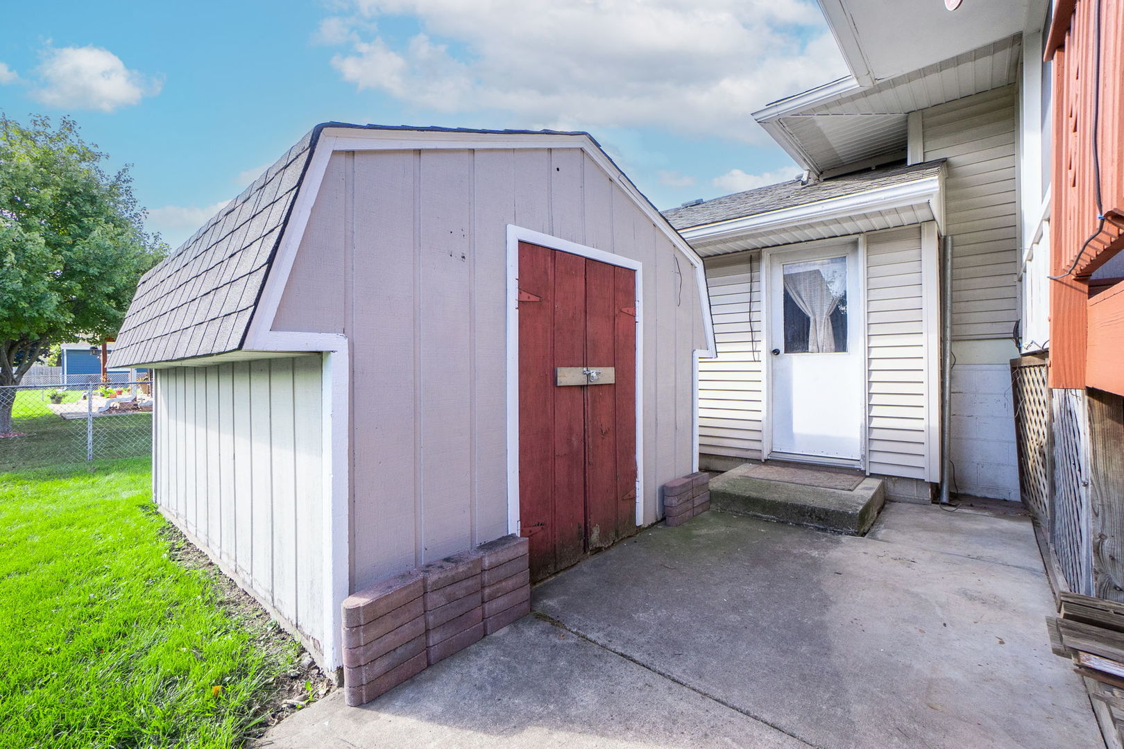 1275 Post Road Aurora, IL 60506 - Photo 23 of 30 a backyard of a house with barbeque oven and garden