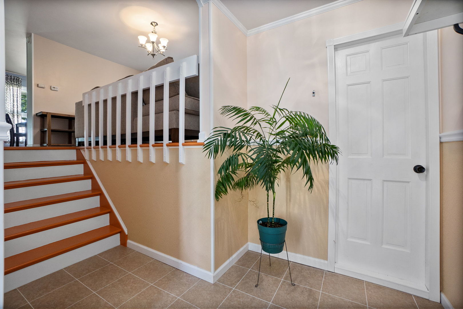 1275 Post Road Aurora, IL 60506 - Photo 5 of 30 a view of entryway with wooden floor and a potted plant