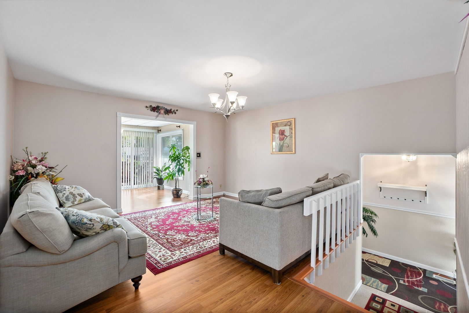 1275 Post Road Aurora, IL 60506 - Photo 6 of 30 a living room with furniture and a chandelier