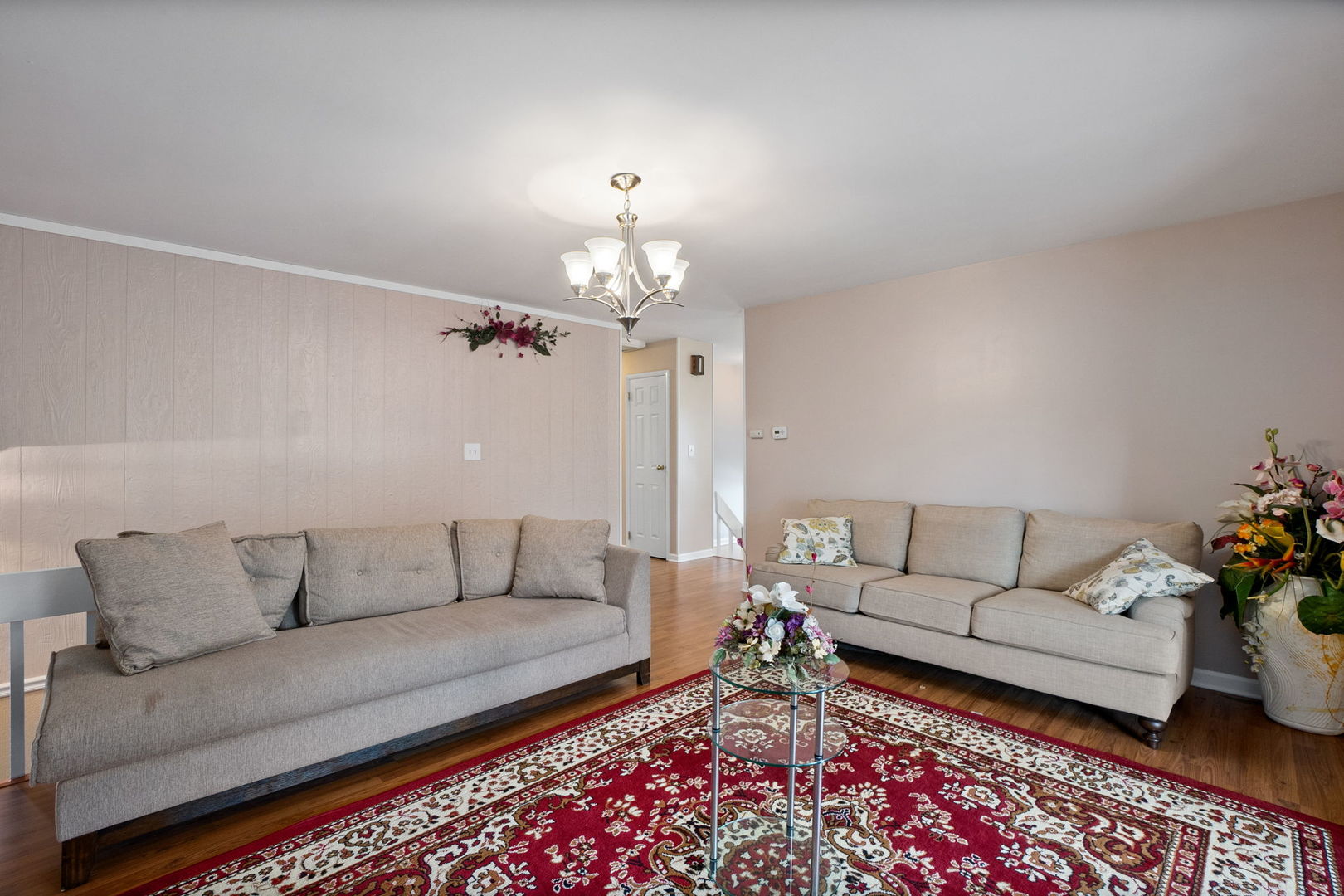 1275 Post Road Aurora, IL 60506 - Photo 7 of 30 a living room with furniture and a chandelier
