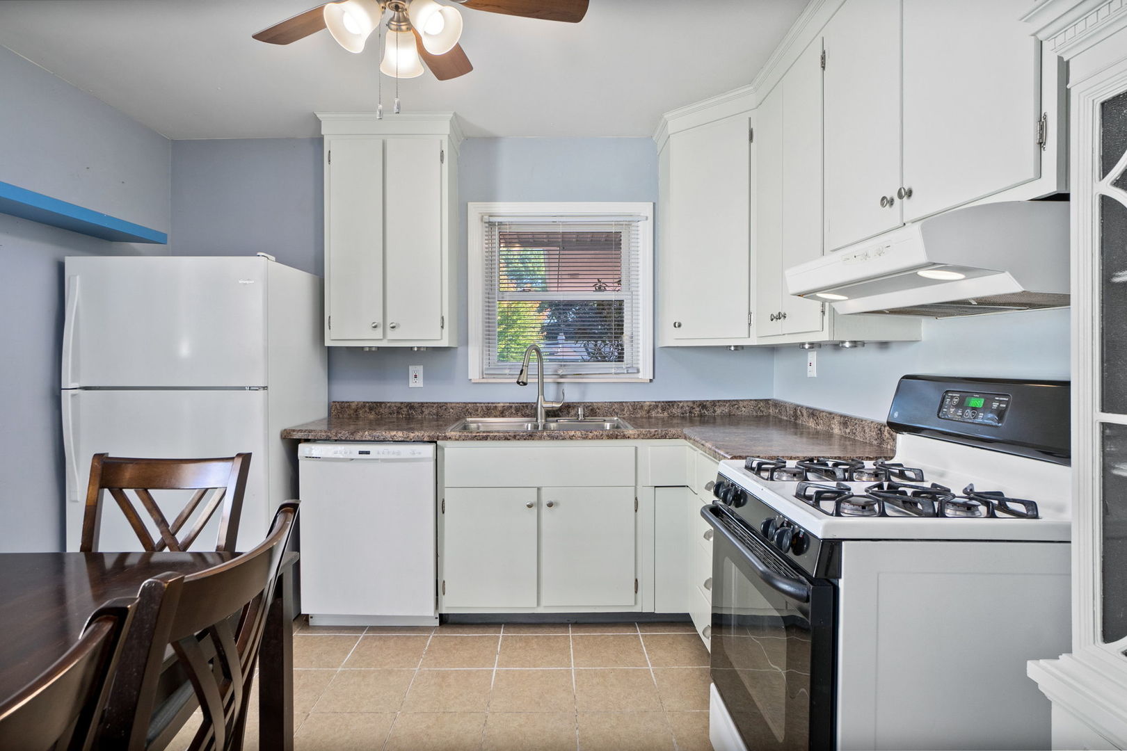 1275 Post Road Aurora, IL 60506 - Photo 10 of 30 a kitchen with stainless steel appliances granite countertop a stove a sink dishwasher and a refrigerator with wooden cabinets