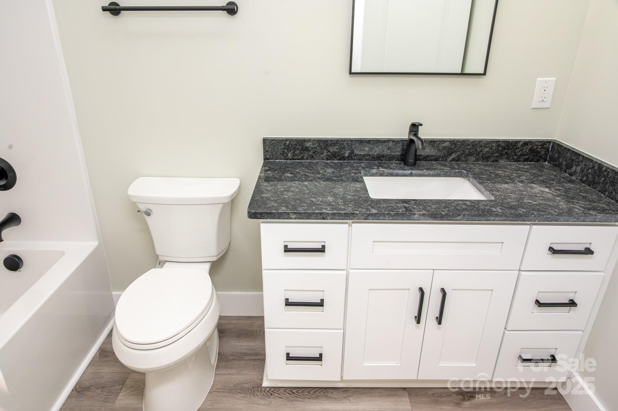43 Robbins Circle Lexington, NC 27292 - Photo 15 of 28 a white toilet sitting next to a bathroom sink