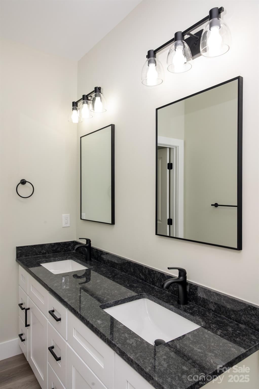 43 Robbins Circle Lexington, NC 27292 - Photo 21 of 28 a bathroom with a granite countertop sink and a mirror