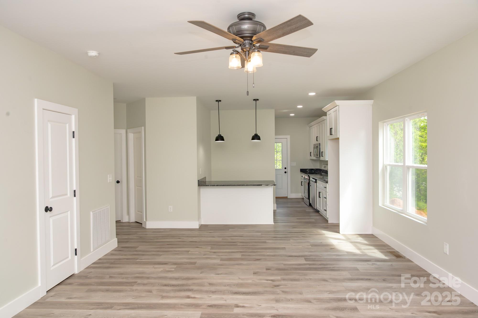 43 Robbins Circle Lexington, NC 27292 - Photo 3 of 28 a view of an empty room kitchen and a ceiling fan