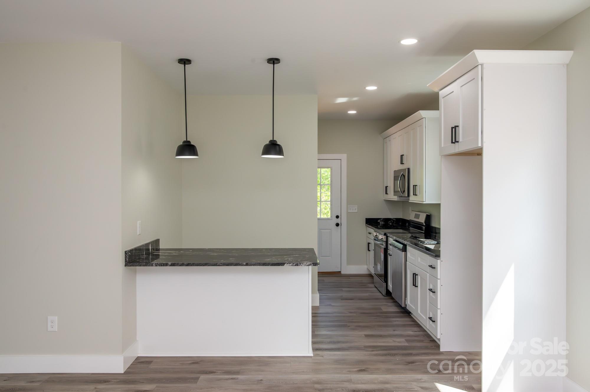 43 Robbins Circle Lexington, NC 27292 - Photo 4 of 28 a view of a kitchen with wooden floor