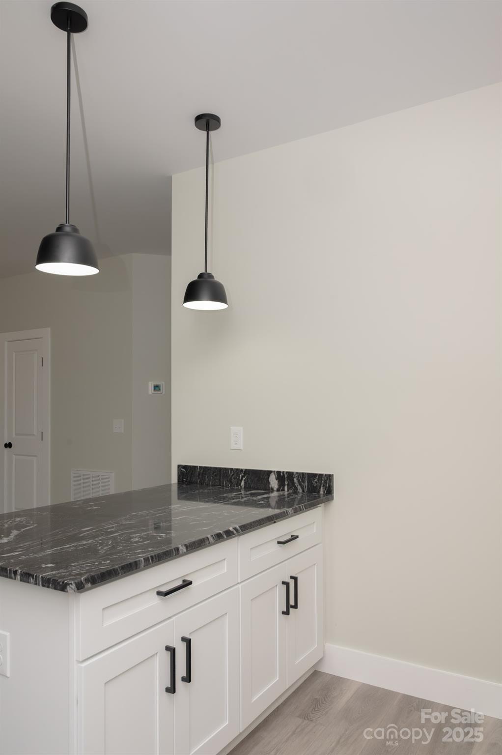 43 Robbins Circle Lexington, NC 27292 - Photo 7 of 28 a kitchen with granite countertop a sink and a stove
