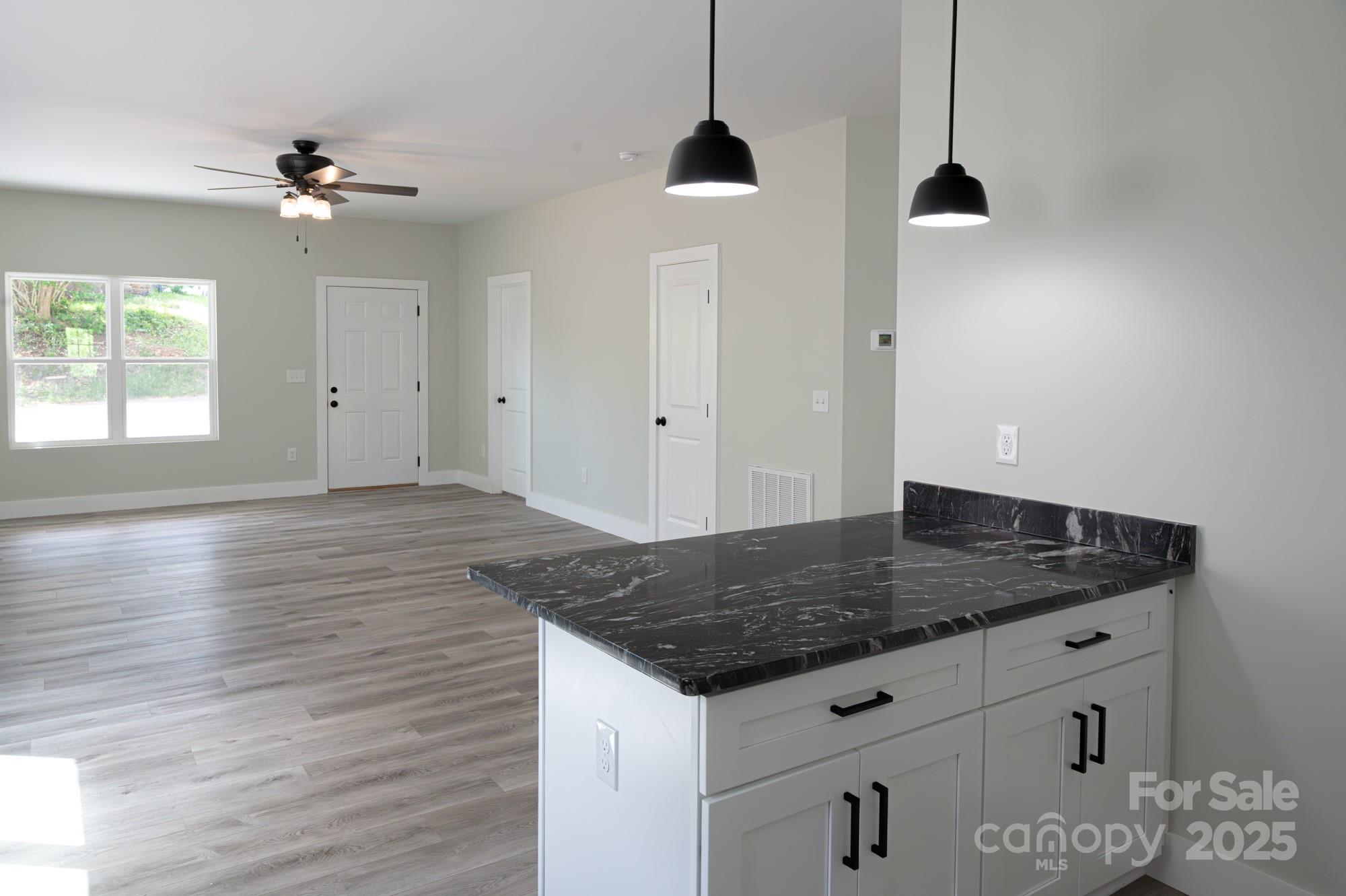 43 Robbins Circle Lexington, NC 27292 - Photo 8 of 28 a kitchen with a sink and chandelier