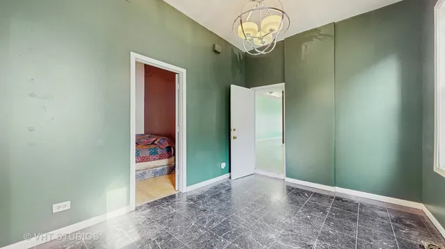 an empty room with a chandelier